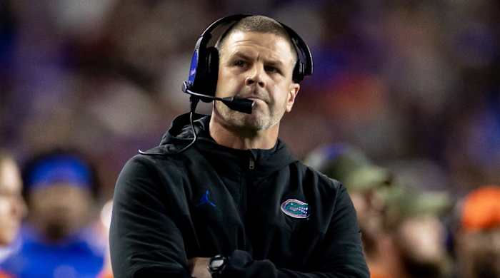 Florida coach Billy Napier with his arms crossed
